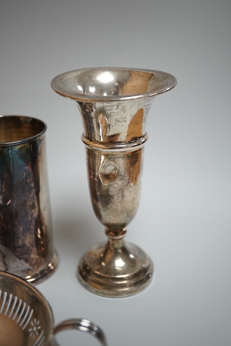 A modern silver oval pedestal sweetmeat bowl, by Mappin & Webb, Birmingham, 1987, 15.8cm, together with a small silver bottle holder, a silver mounted vase and a sterling two handled nut dish.